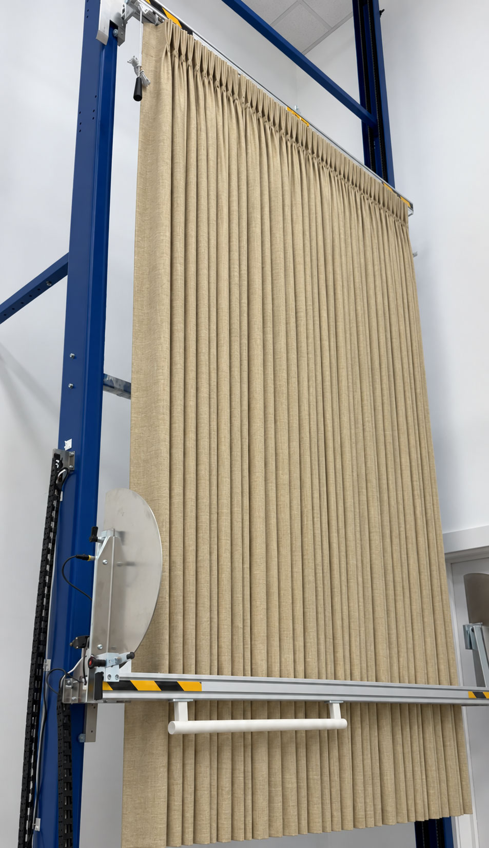 Neutral custom drapery being fan-folded for shipping at Regal Drapes